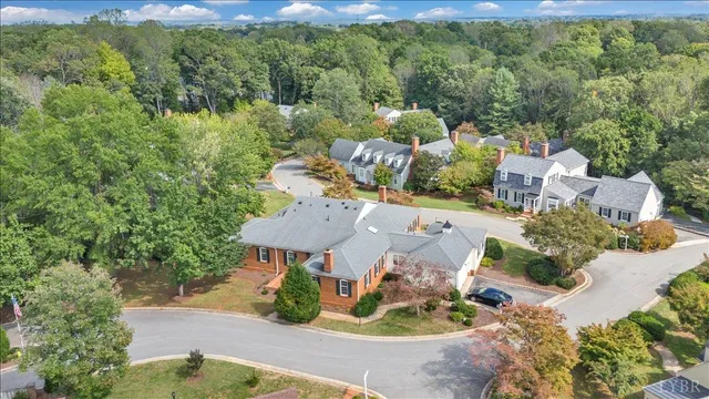 an aerial view of a house with yard swimming pool and outdoor seating