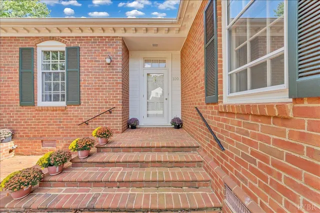 a view of a brick building with many windows