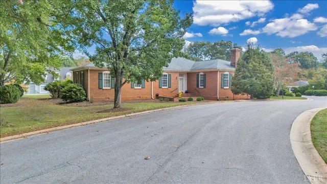 a view of a house with palm trees