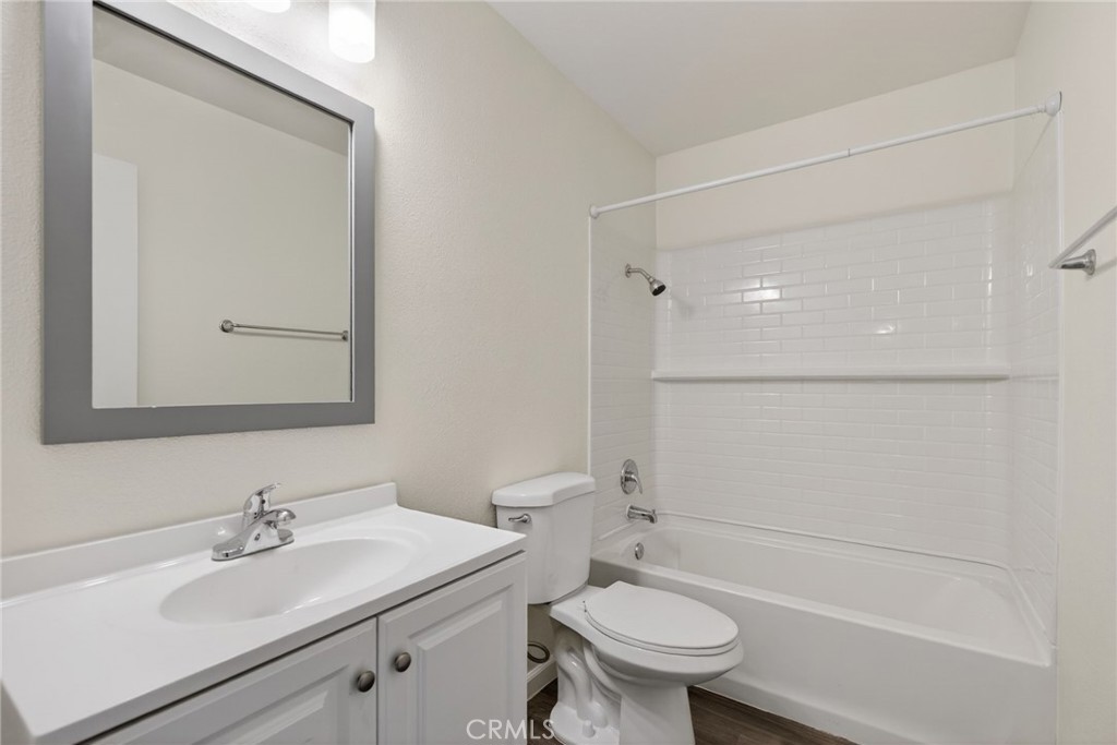2891 Canyon Crest, Unit 32 Riverside, CA 92507 - Photo 17 of 27 a bathroom with a sink a toilet and shower