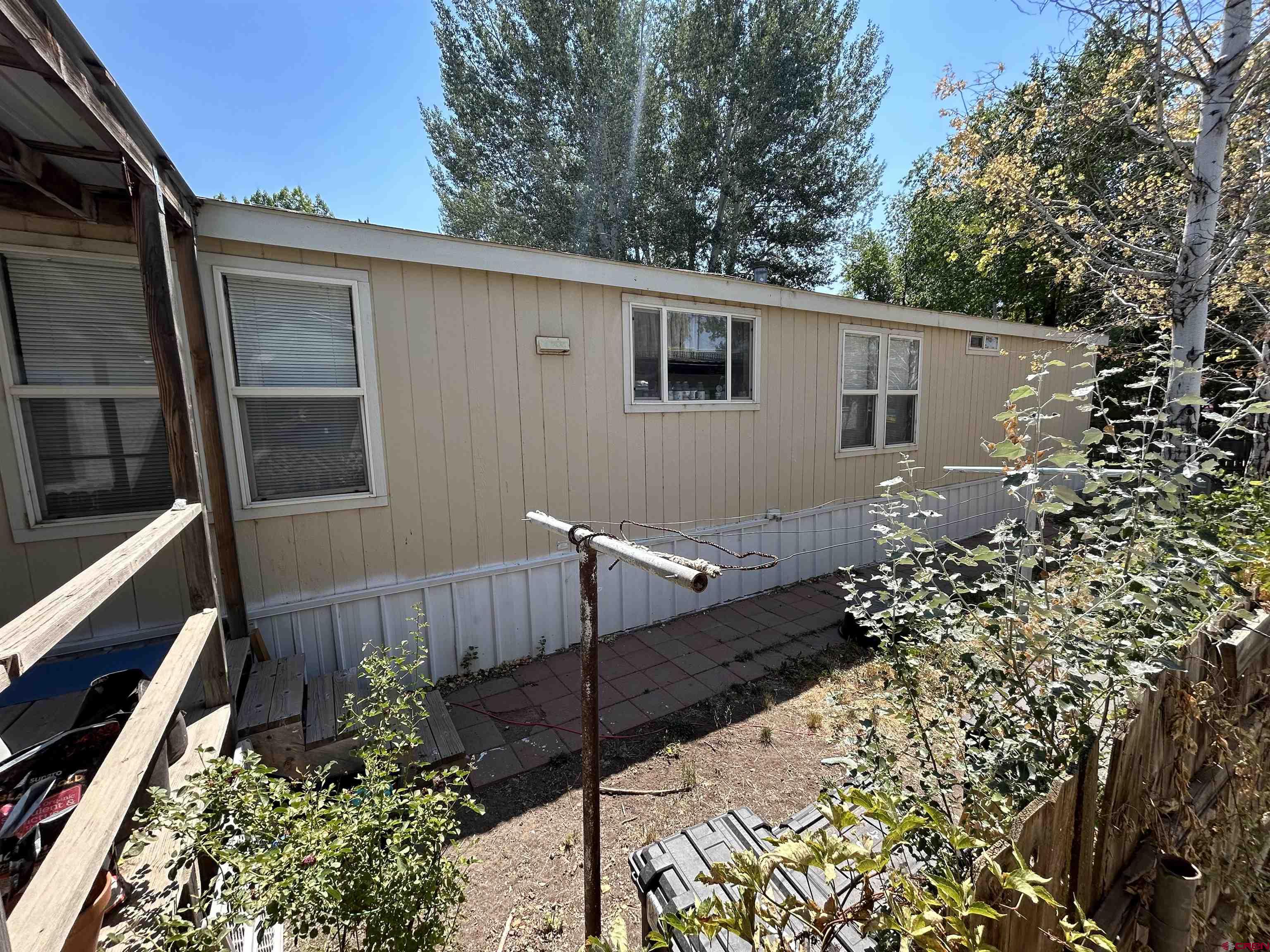 28260 Highway 160, Unit 1 Cortez, CO 81321 - Photo 2 of 21 a view of house with backyard and trees