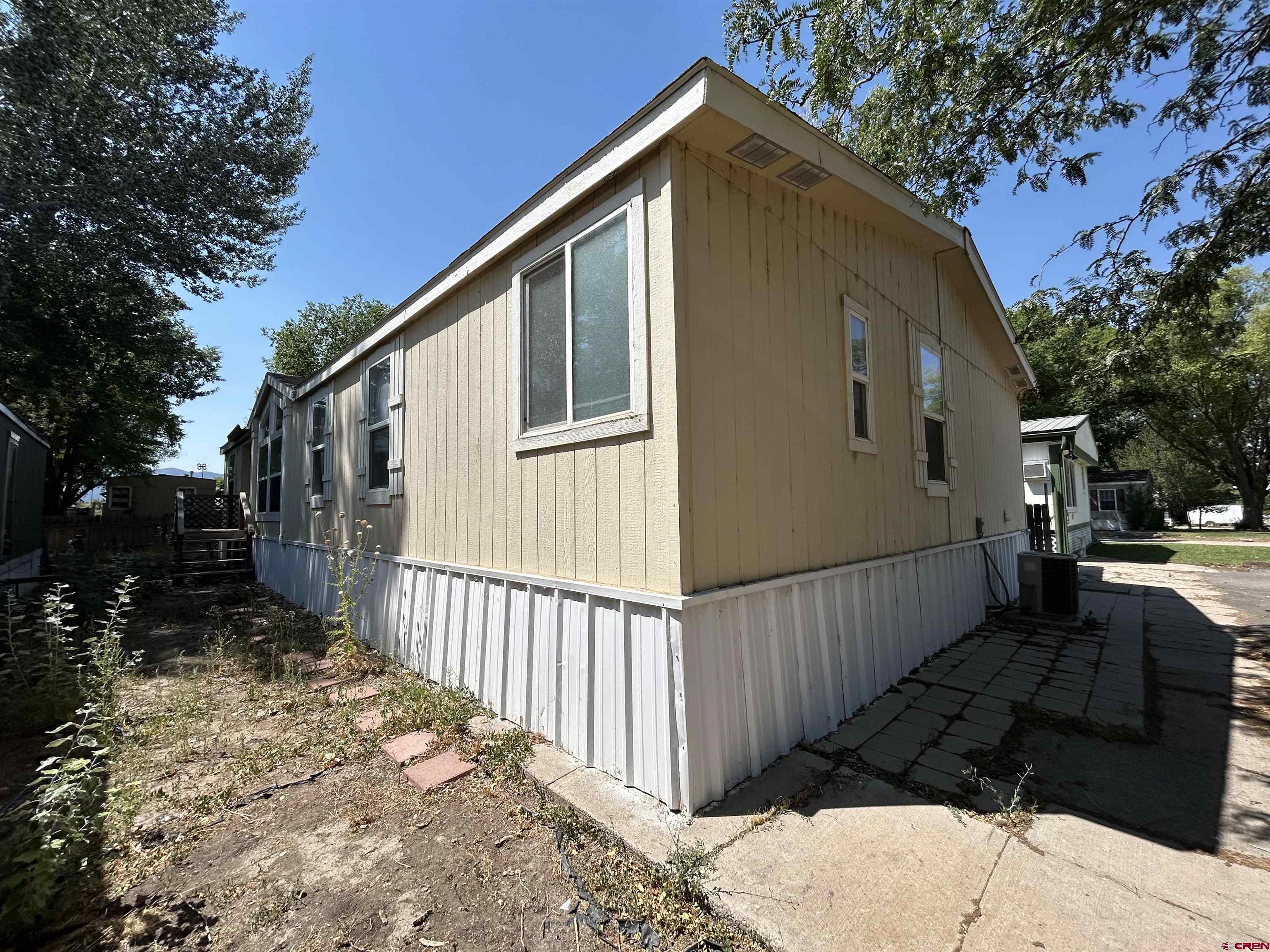 28260 Highway 160, Unit 1 Cortez, CO 81321 - Photo 3 of 21 a view of a house with a yard