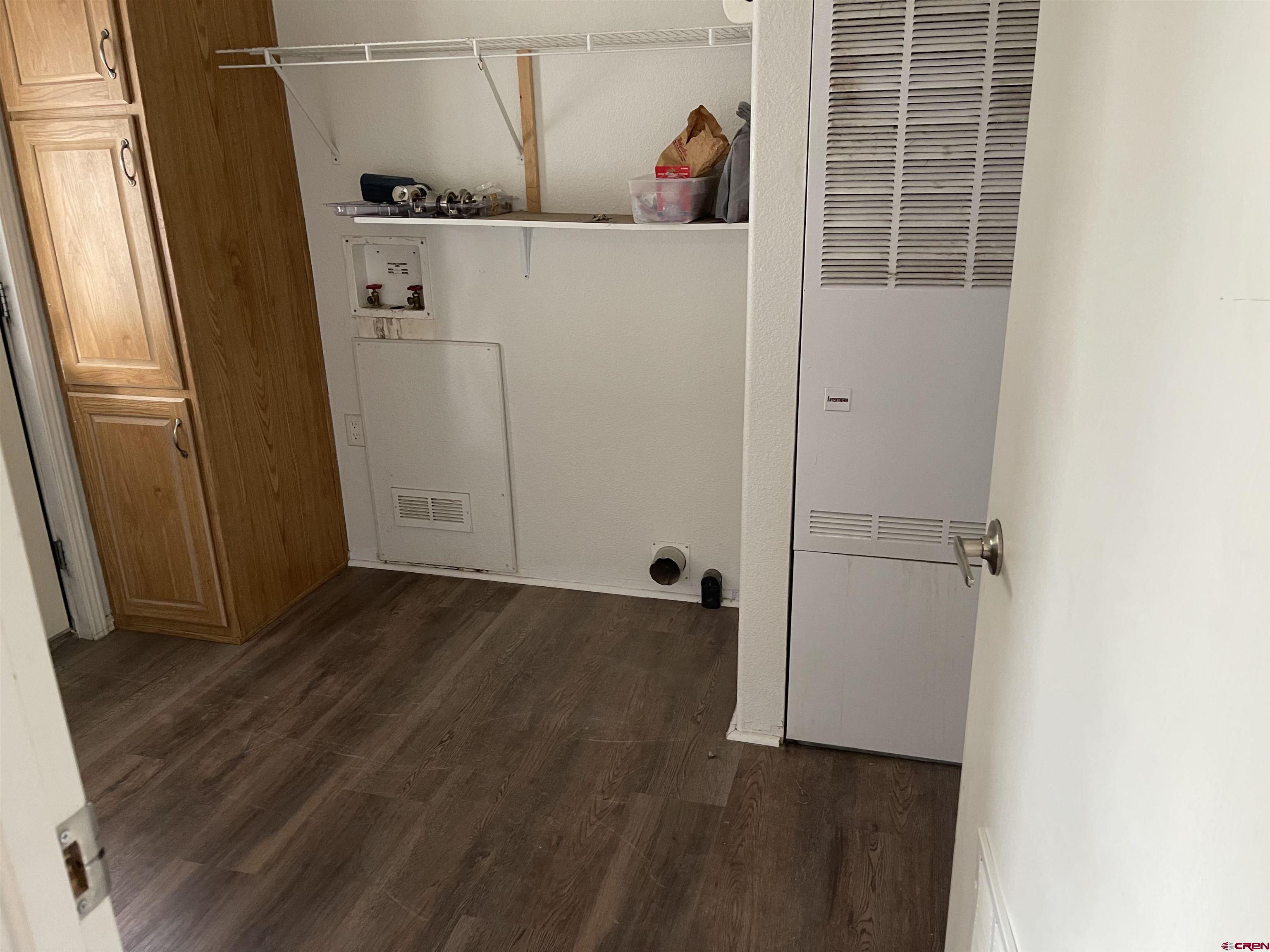 28260 Highway 160, Unit 1 Cortez, CO 81321 - Photo 5 of 21 a view of walk in closet with clothes and shoes