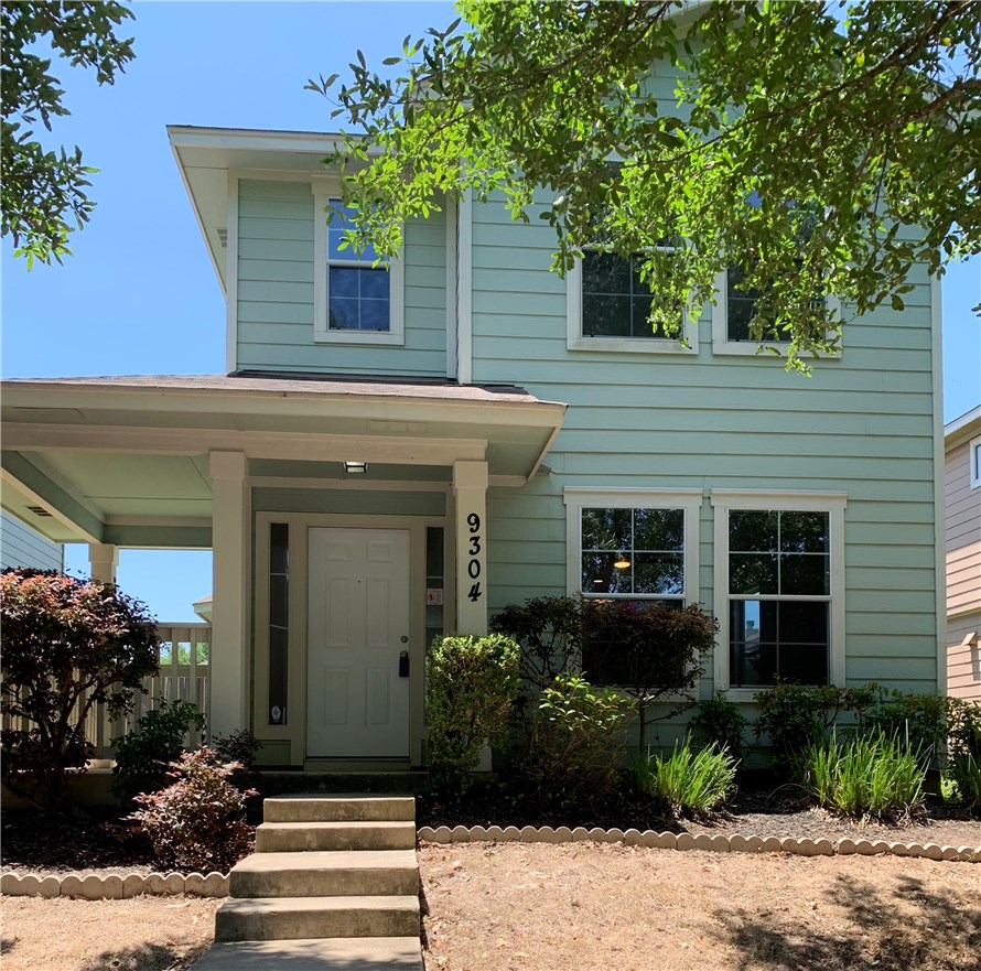 9304 Rowlands Sayle Road Austin, TX 78744 - Photo 1 of 1 a front view of a house with plants