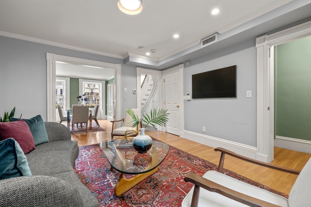 14 Pinckney Street Boston, MA 02114 - Photo 3 of 27 a living room with furniture and a flat screen tv