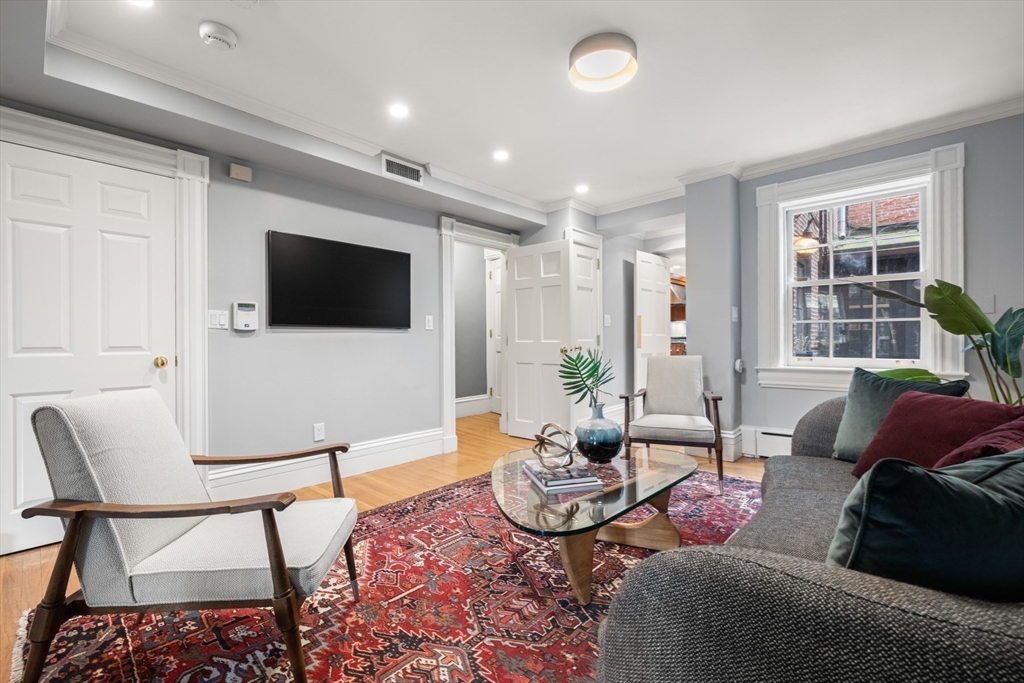 14 Pinckney Street Boston, MA 02114 - Photo 6 of 27 a living room with furniture and a flat screen tv