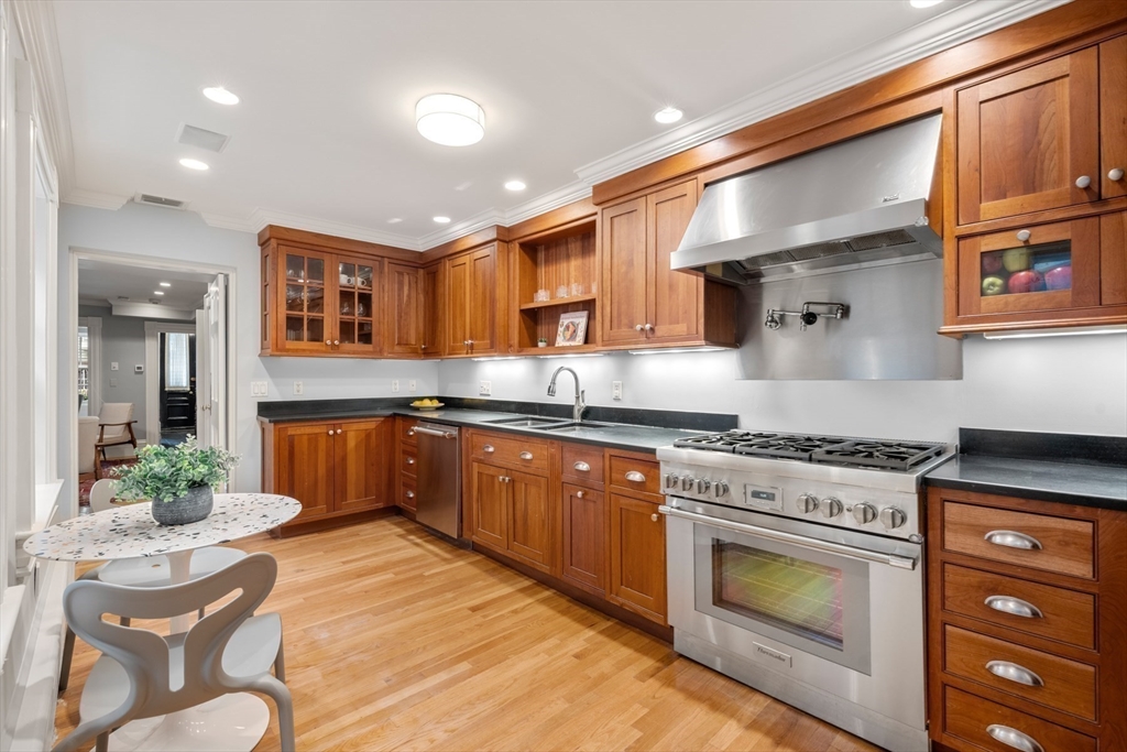 14 Pinckney Street Boston, MA 02114 - Photo 7 of 27 a kitchen with stainless steel appliances granite countertop a stove sink and cabinets