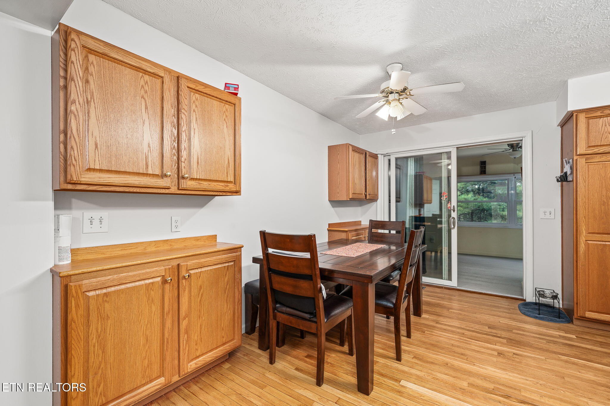 614 West Creston Road Crossville, TN 38571 - Photo 11 of 47 a view of a dining room with furniture and wooden floor