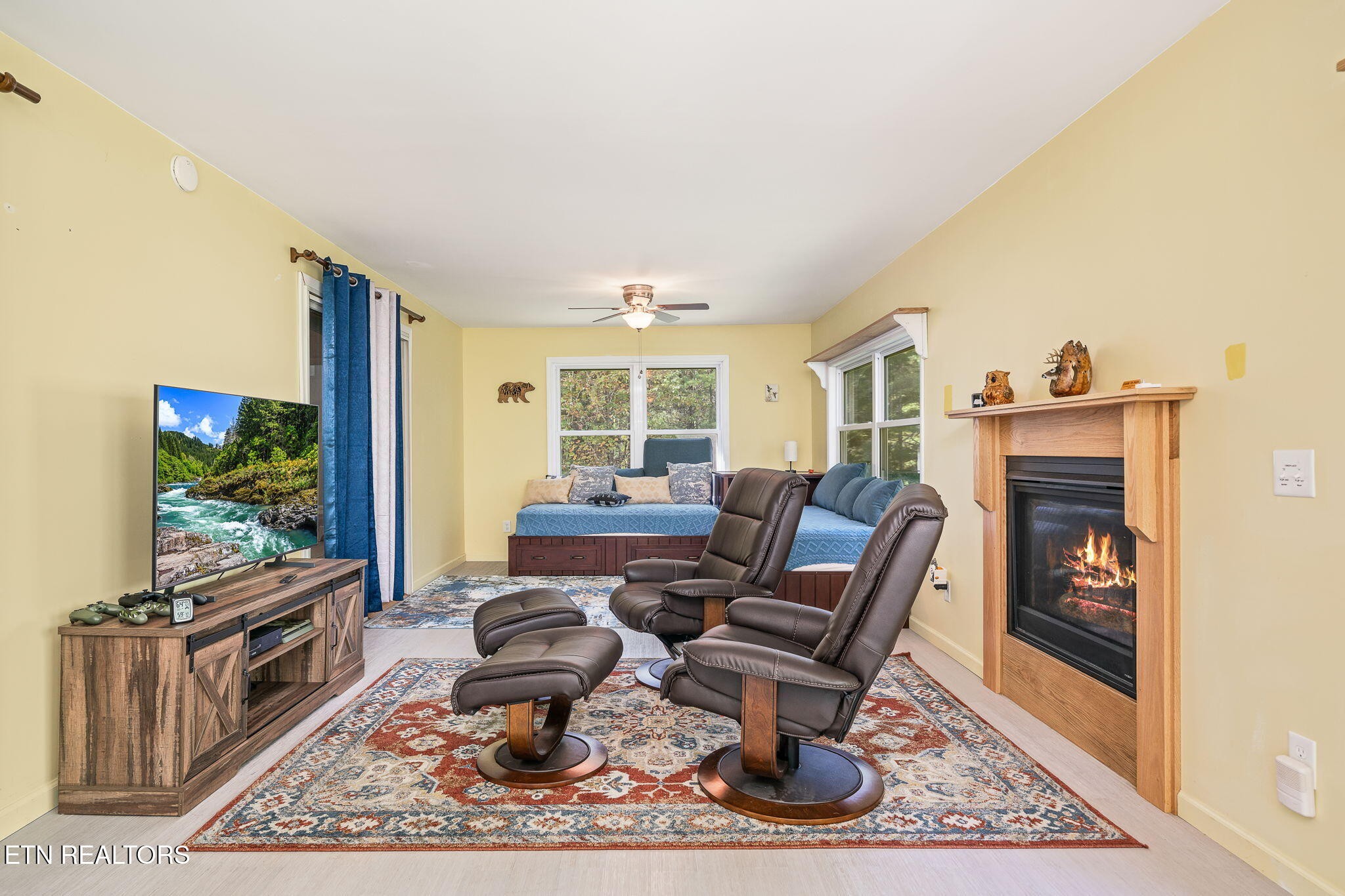 614 West Creston Road Crossville, TN 38571 - Photo 14 of 47 a living room with furniture a rug and a flat screen tv