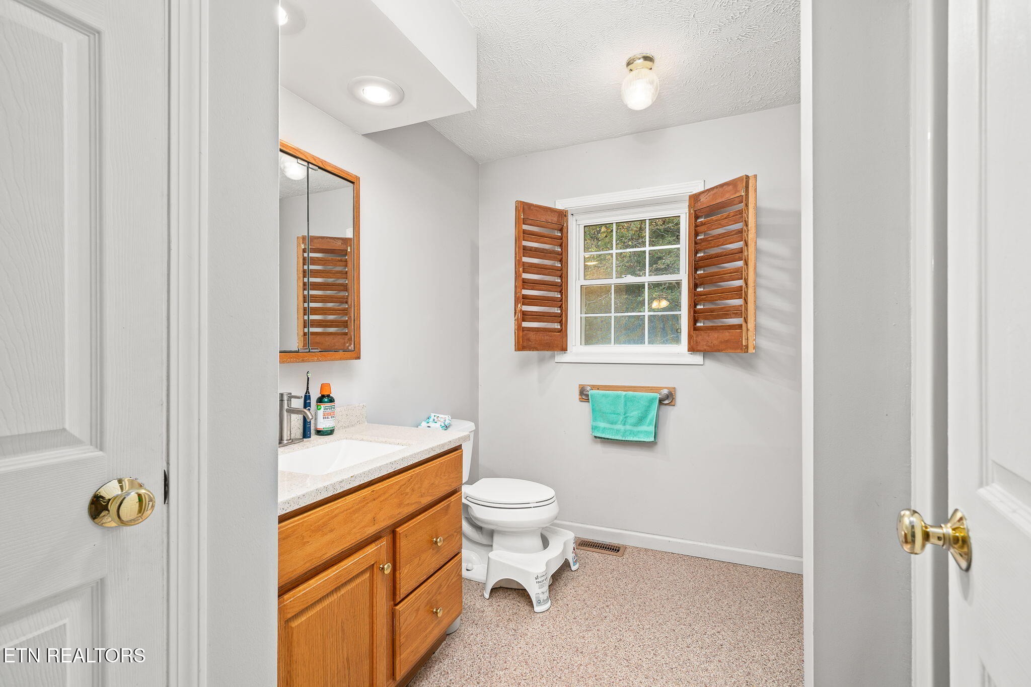 614 West Creston Road Crossville, TN 38571 - Photo 18 of 47 a bathroom with a sink toilet and shower
