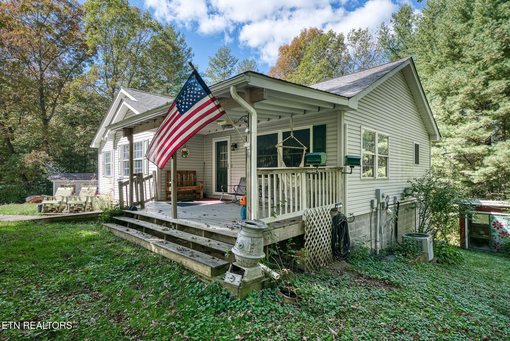 614 West Creston Road Crossville, TN 38571 - Photo 2 of 47 a front view of a house with a garden
