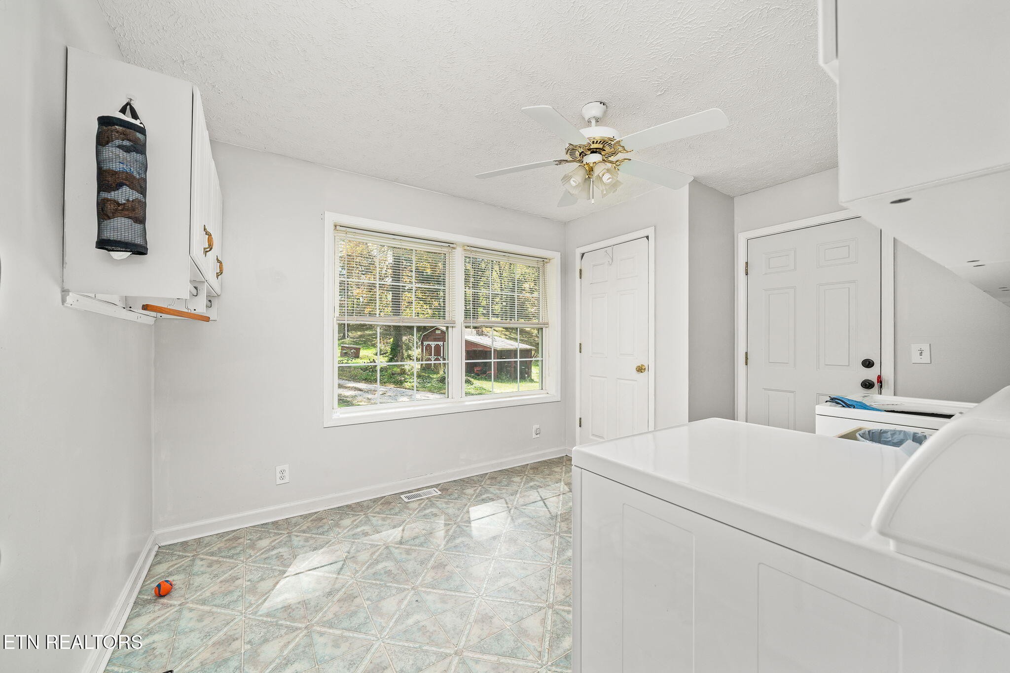 614 West Creston Road Crossville, TN 38571 - Photo 22 of 47 a room with a bed and a chandelier