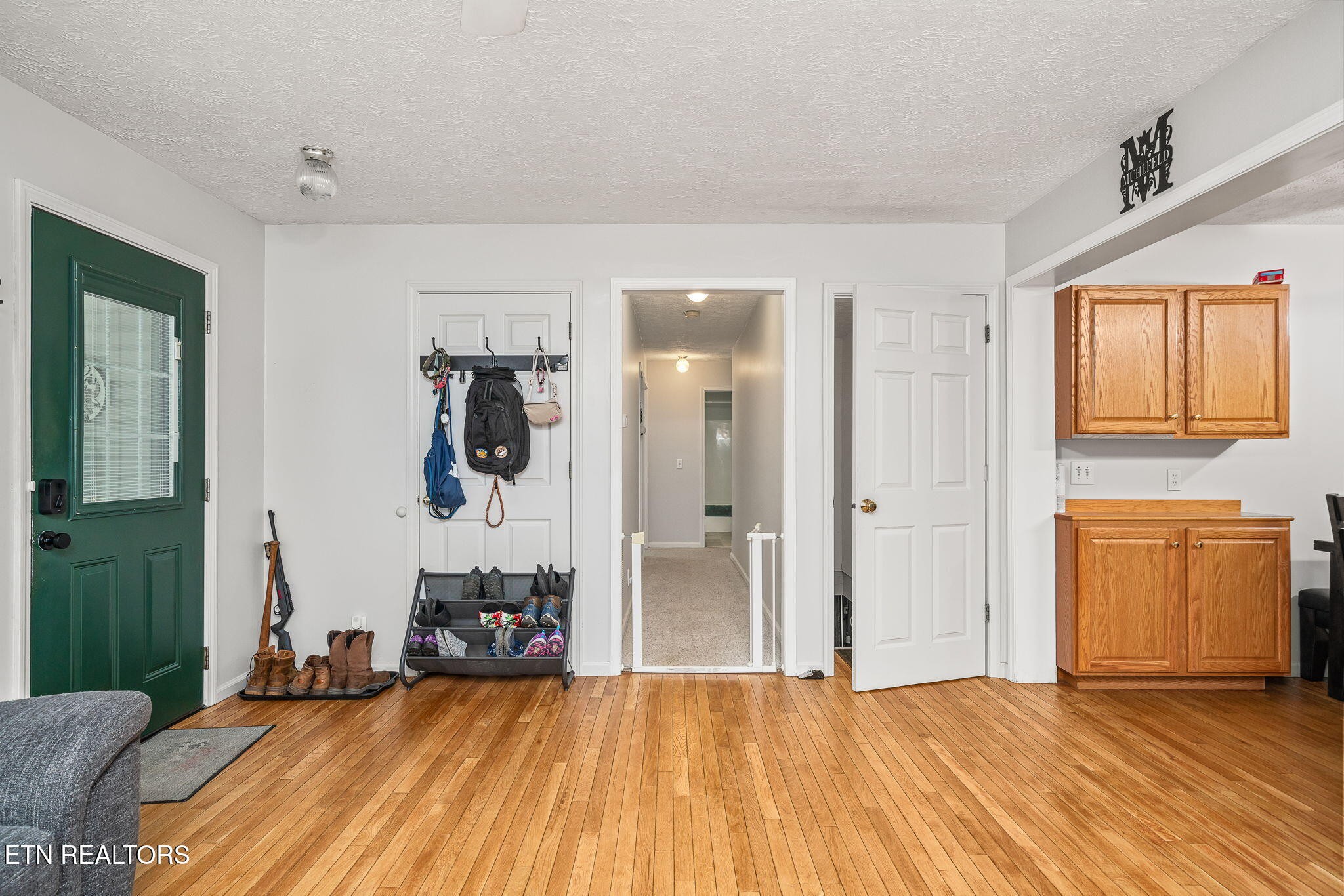 614 West Creston Road Crossville, TN 38571 - Photo 8 of 47 a bedroom with a bed and wooden floor