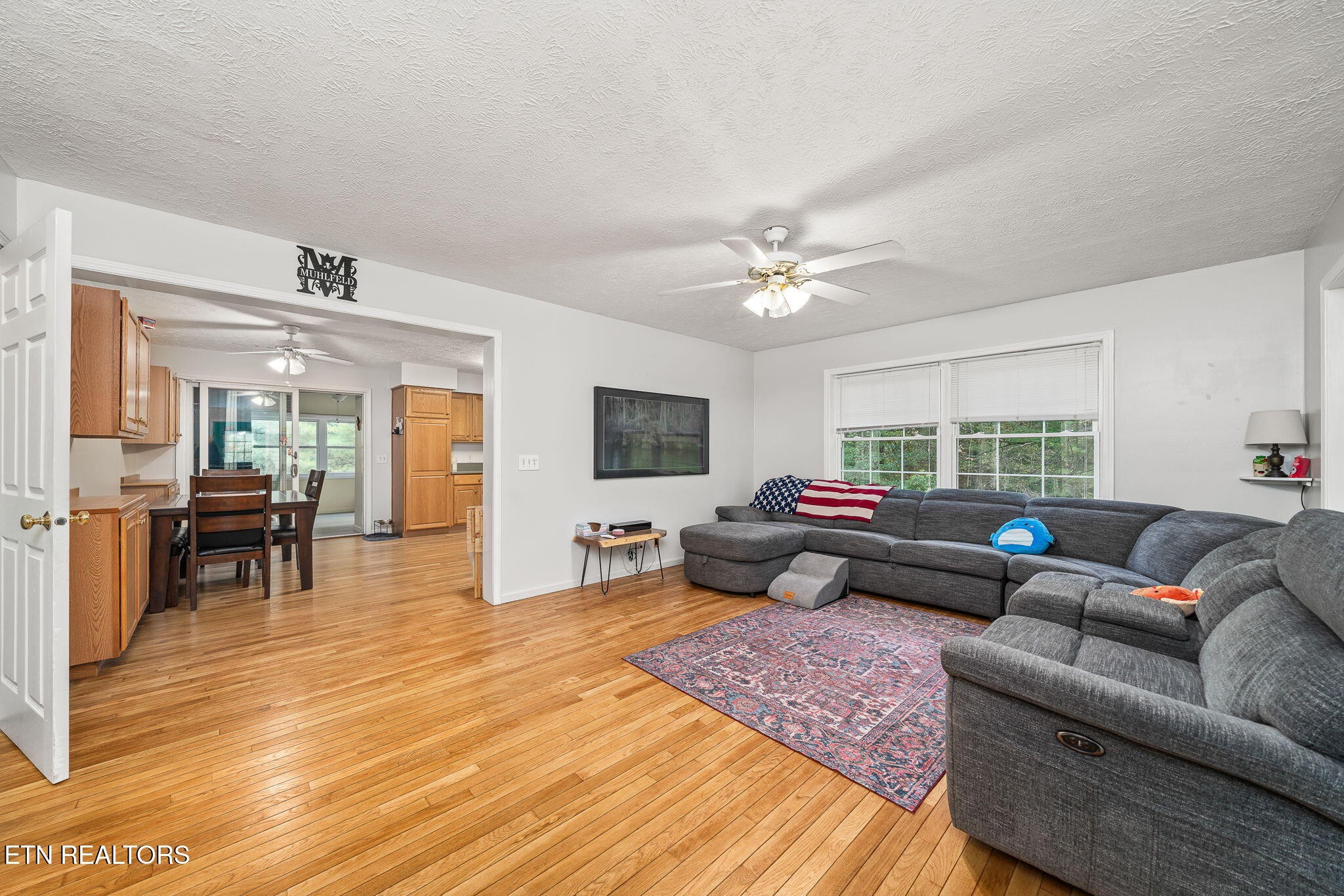 614 West Creston Road Crossville, TN 38571 - Photo 9 of 47 a living room with furniture and a flat screen tv