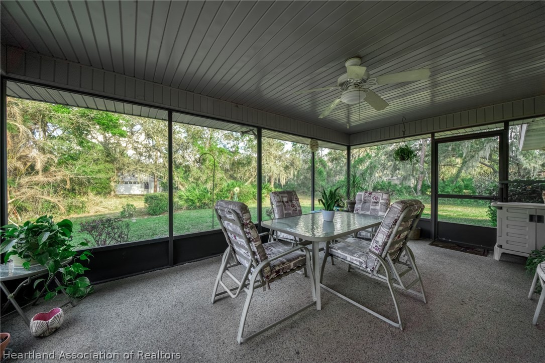 5802 Golden Road Sebring, FL 33875 - Photo 26 of 37 a dining room with furniture and garden view