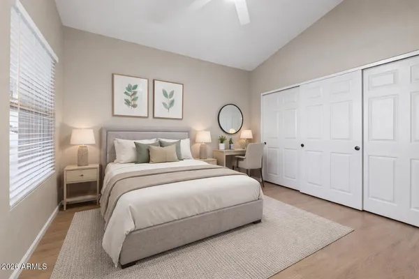 a kitchen with granite countertop a sink a stove and cabinets