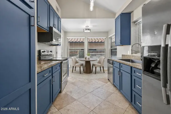 a view of a white house with a yard