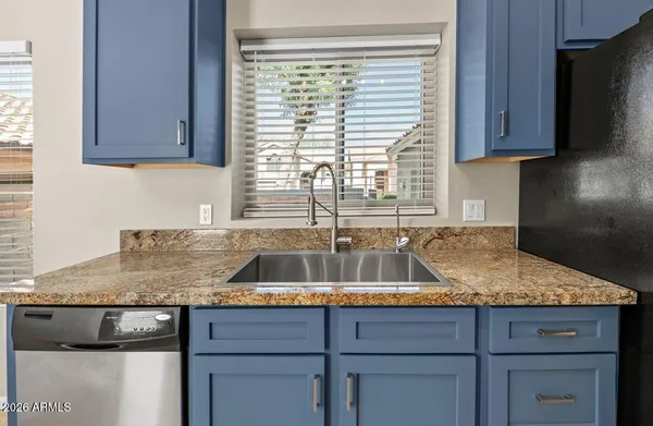 a view of a swimming pool and lounge chairs