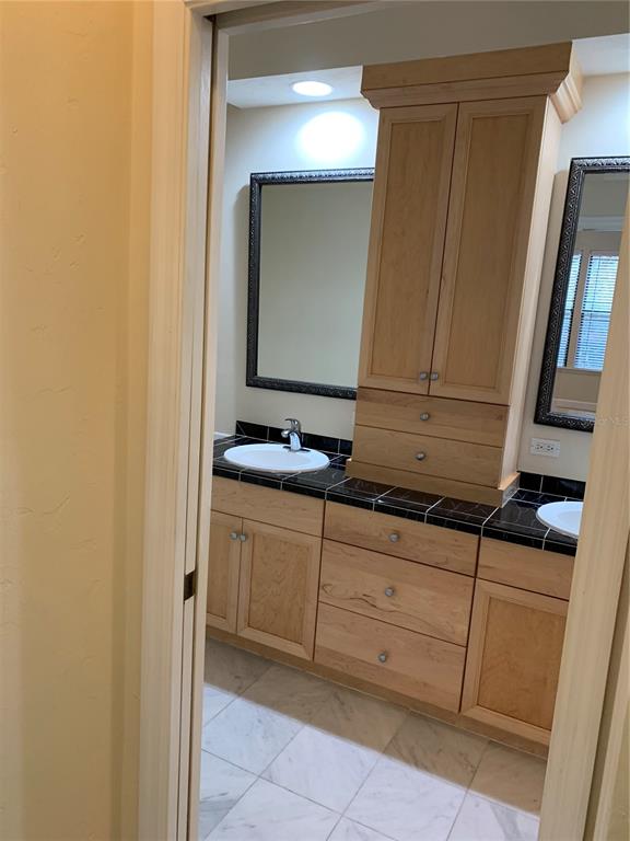 187 Southwest 129 Terrace Newberry, FL 32669 - Photo 11 of 39 a bathroom with a sink and a mirror