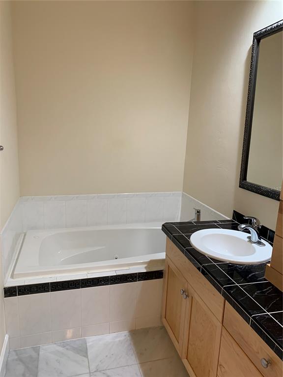 187 Southwest 129 Terrace Newberry, FL 32669 - Photo 12 of 39 a bathroom with a sink and a mirror