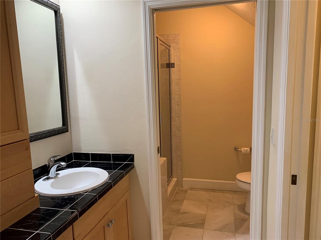 187 Southwest 129 Terrace Newberry, FL 32669 - Photo 15 of 39 a bathroom with a sink and a mirror