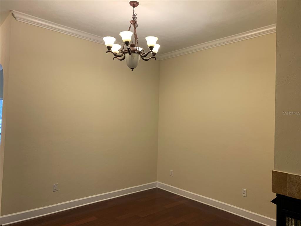 187 Southwest 129 Terrace Newberry, FL 32669 - Photo 17 of 39 a view of a room with wooden floor and chandelier