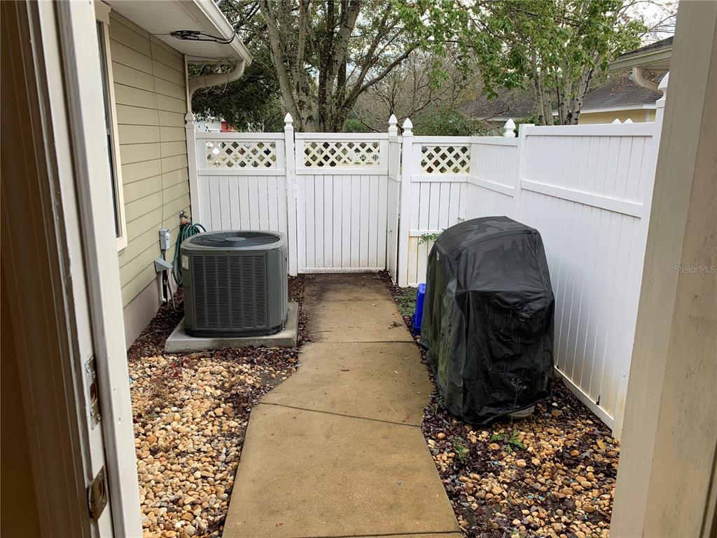 187 Southwest 129 Terrace Newberry, FL 32669 - Photo 26 of 39 a view of a pathway of a house with wooden fence