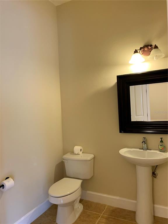 187 Southwest 129 Terrace Newberry, FL 32669 - Photo 27 of 39 a bathroom with a sink and a toilet