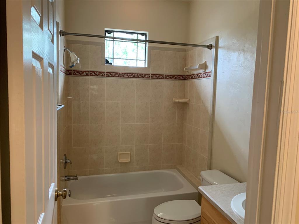 187 Southwest 129 Terrace Newberry, FL 32669 - Photo 36 of 39 a bathroom with a toilet and a bathtub