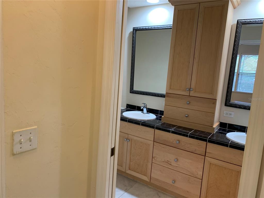 187 Southwest 129 Terrace Newberry, FL 32669 - Photo 10 of 39 a bathroom with a sink and a mirror