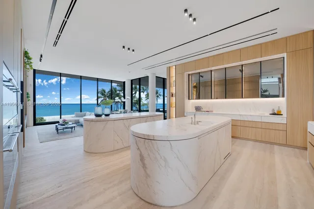 a bathroom with a granite countertop toilet a sink and a mirror