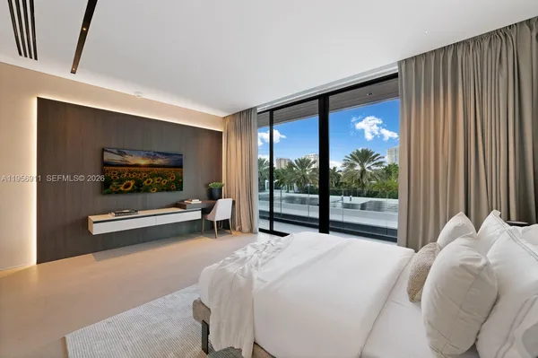 a bathroom with a granite countertop sink a mirror and shower