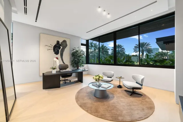 a bathroom with a double vanity sink a mirror and a bathtub