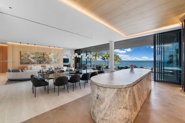 a kitchen with stainless steel appliances a sink and a refrigerator