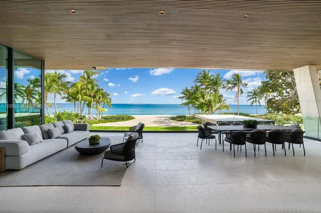 a bathroom with a granite countertop sink and a large mirror
