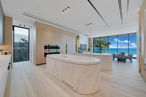 a kitchen with stainless steel appliances a refrigerator and a stove