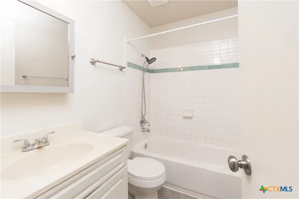 a bathroom with a sink a toilet and a bathtub