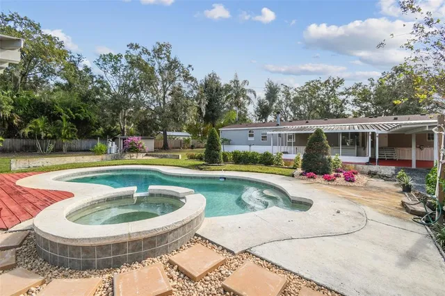a view of a swimming pool with a patio