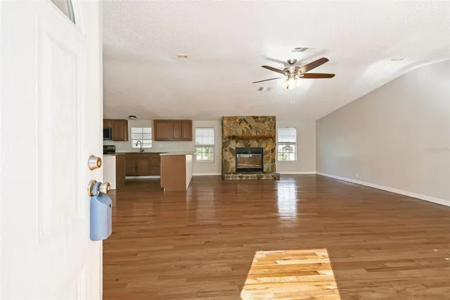 a view of kitchen and dining room with wooden floor