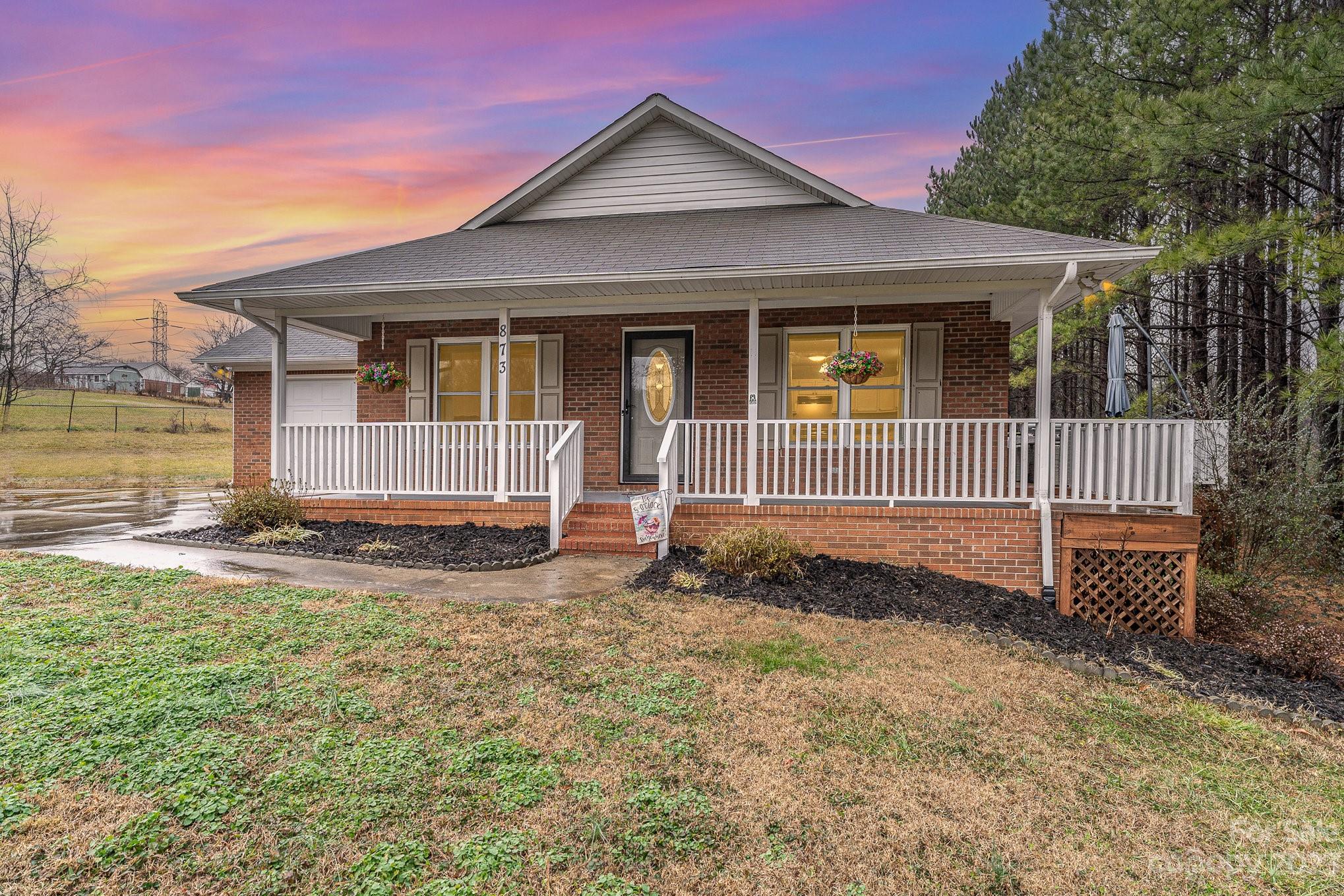 873 Gladstone Road Mocksville, NC 27028 - Photo 1 of 29 a view of a house with backyard and garden