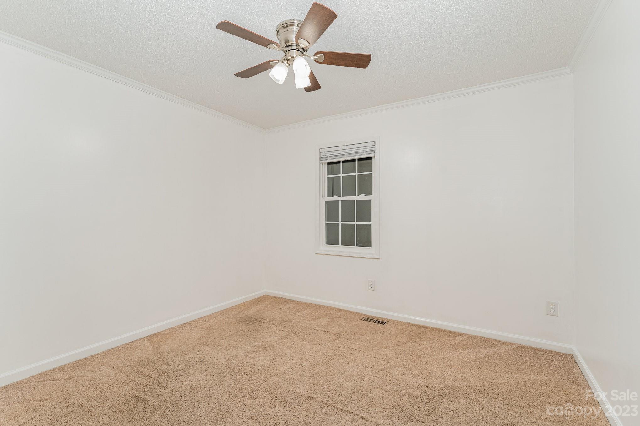 873 Gladstone Road Mocksville, NC 27028 - Photo 15 of 29 an empty room with windows and fan