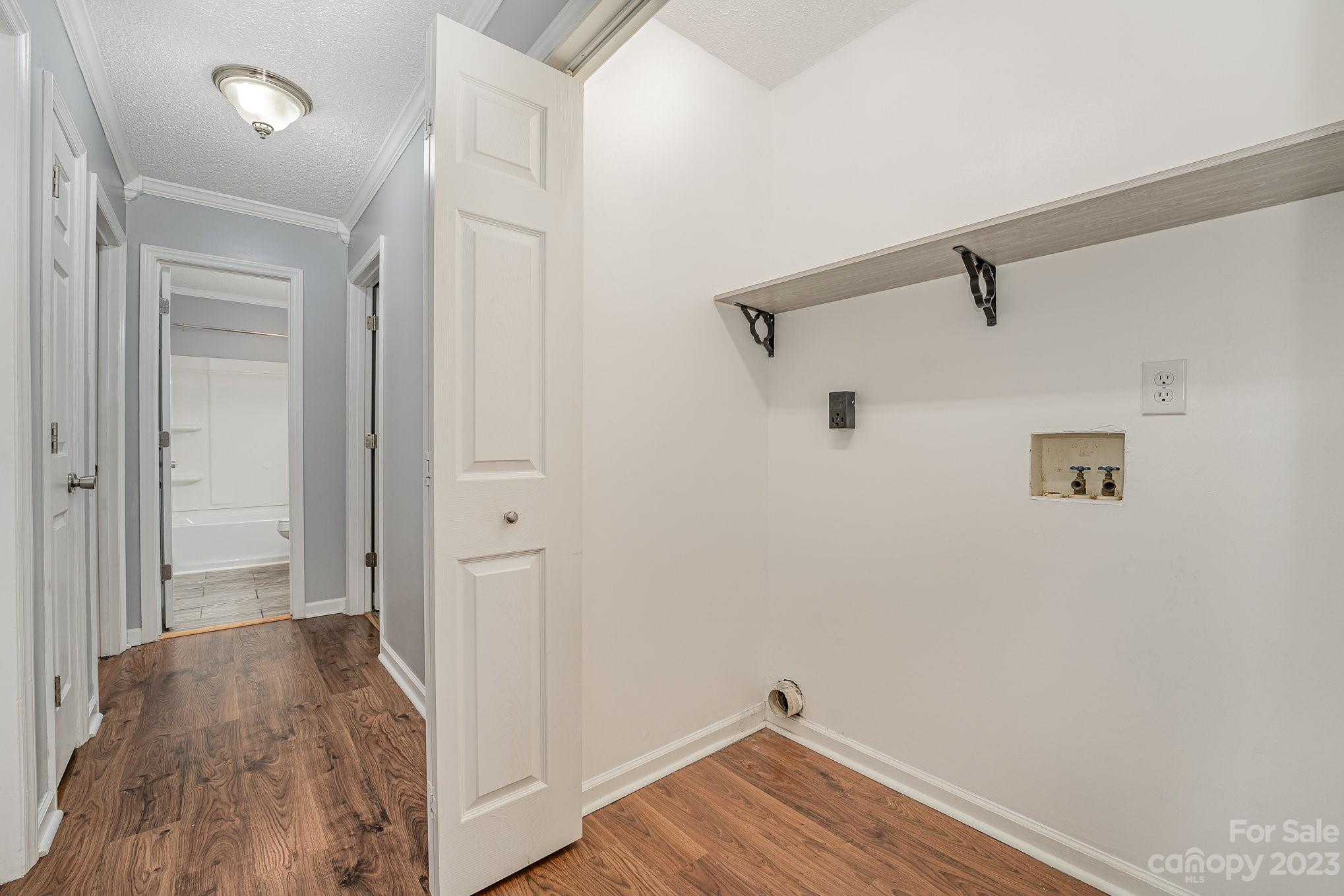 873 Gladstone Road Mocksville, NC 27028 - Photo 25 of 29 a view of a hallway with wooden floor