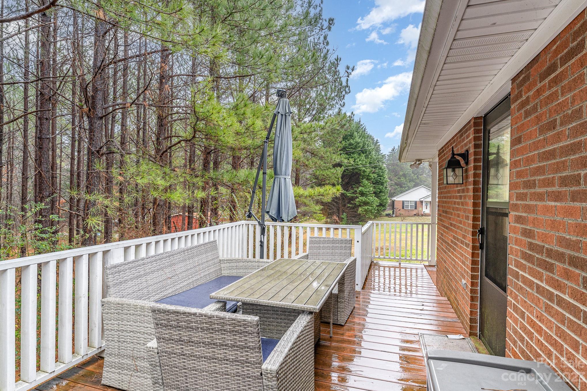 873 Gladstone Road Mocksville, NC 27028 - Photo 26 of 29 a balcony with wooden floor and fence