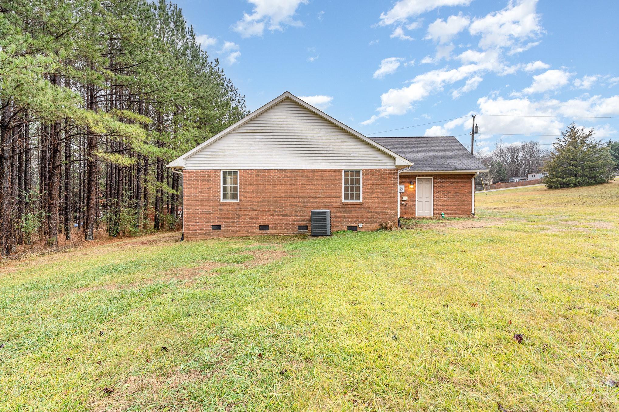 873 Gladstone Road Mocksville, NC 27028 - Photo 28 of 29 a view of a house with a yard and garage