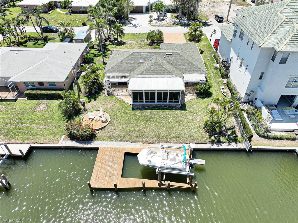 177 Channel Drive Naples, FL 34108 - Photo 14 of 23 an aerial view of a house with swimming pool and outdoor space