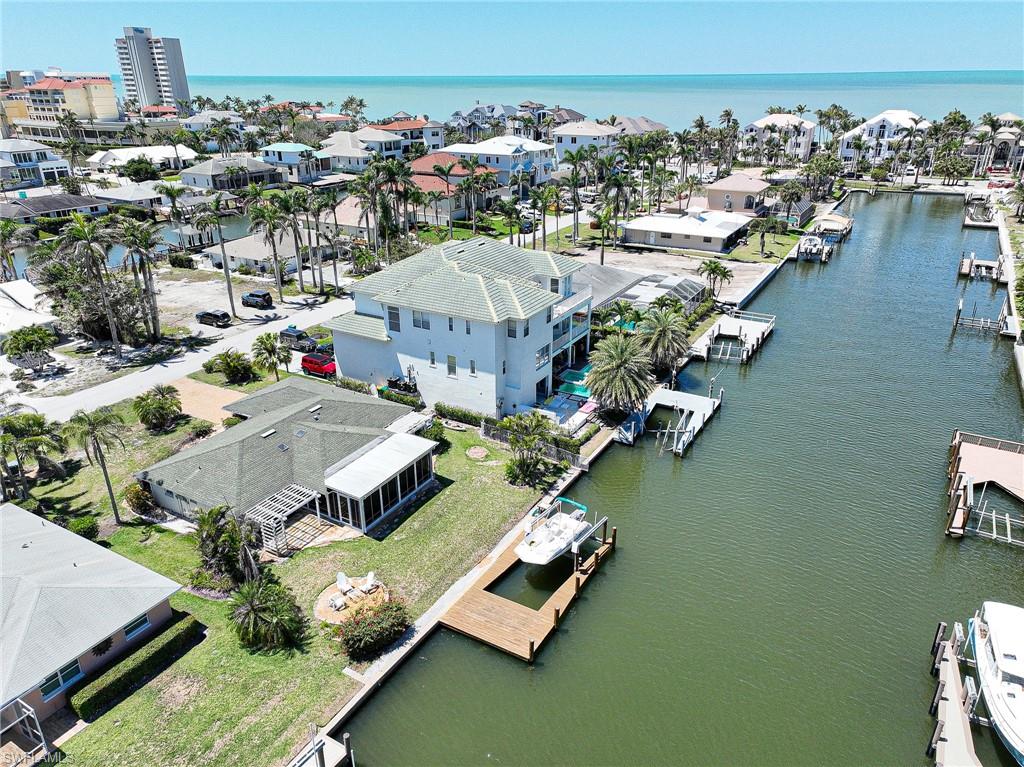 177 Channel Drive Naples, FL 34108 - Photo 17 of 23 an aerial view of a house with a ocean view