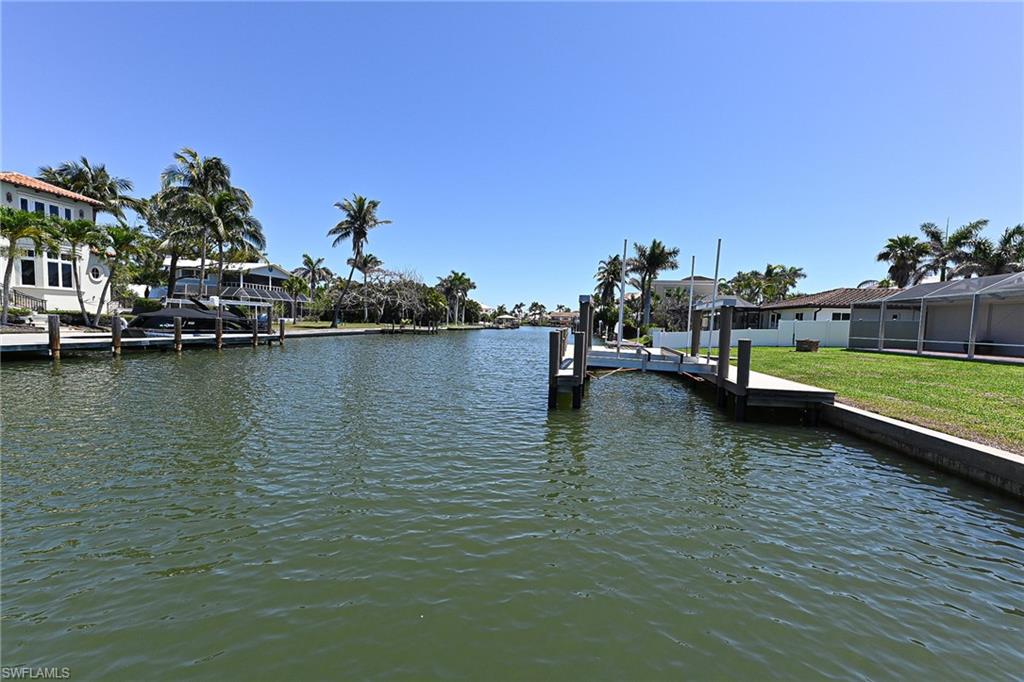 177 Channel Drive Naples, FL 34108 - Photo 23 of 23 a view of a lake with houses