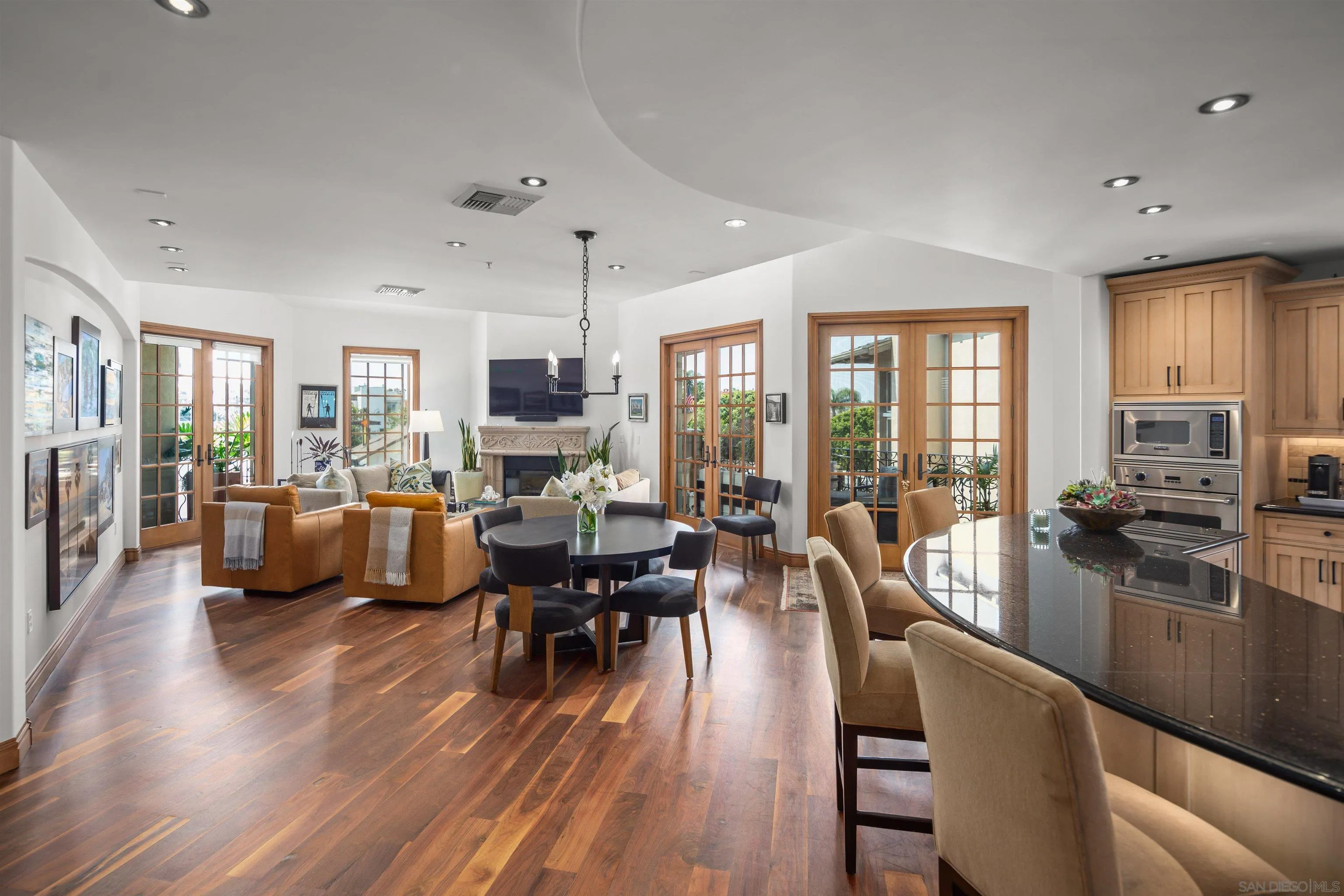 120 C Avenue, Unit 308 Coronado, CA 92118 - Photo 1 of 1 a view of a dining room with furniture window and wooden floor