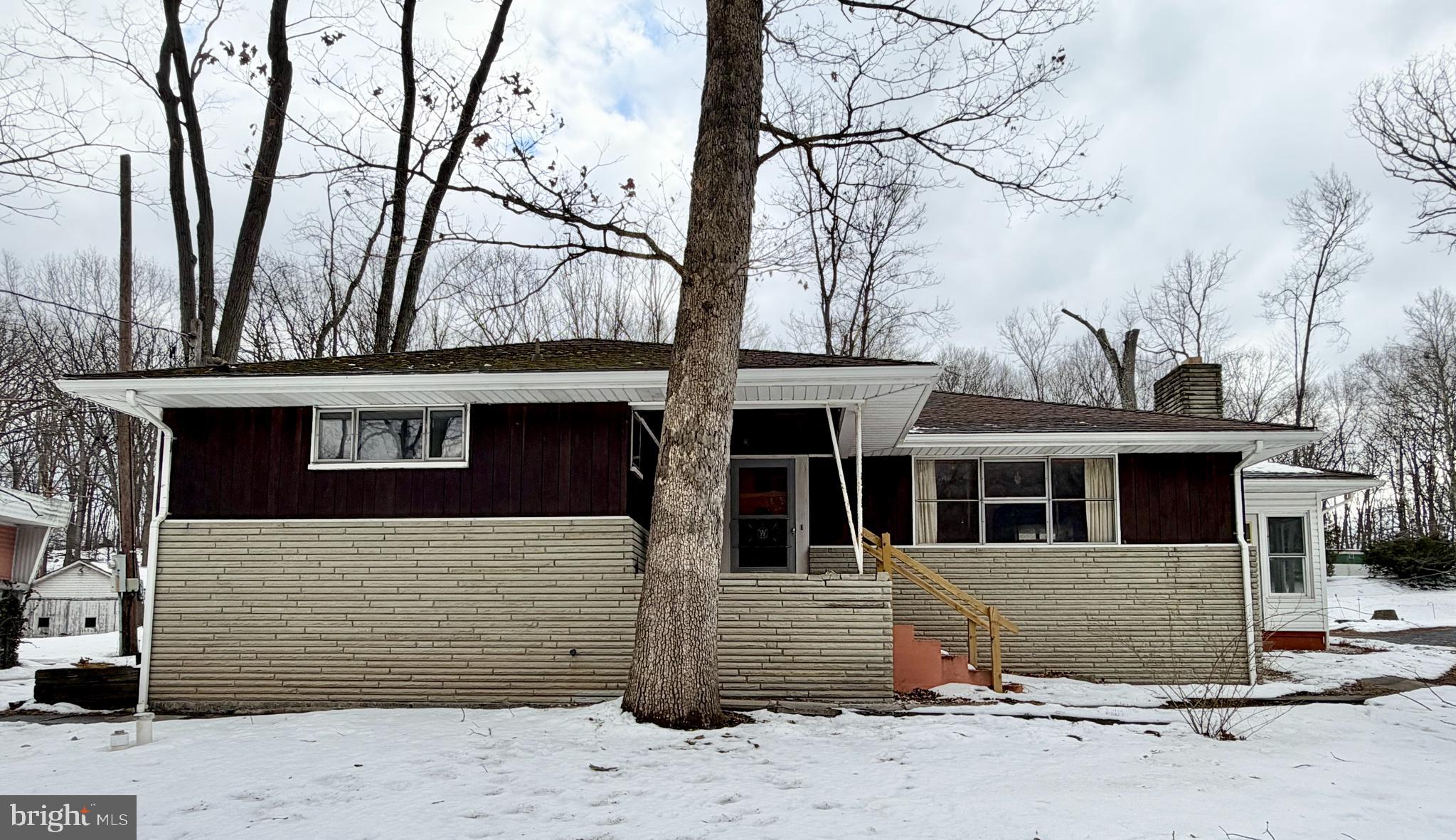 624 Raystown Road Everett, PA 15537 - Photo 2 of 30 a front view of a house with a tree