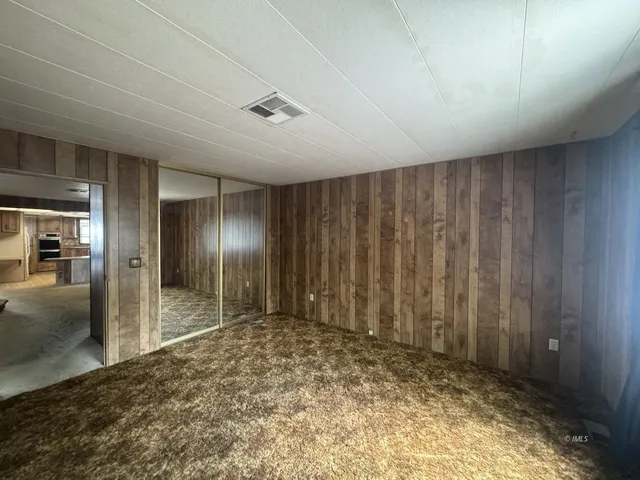 a living room with furniture and a clock